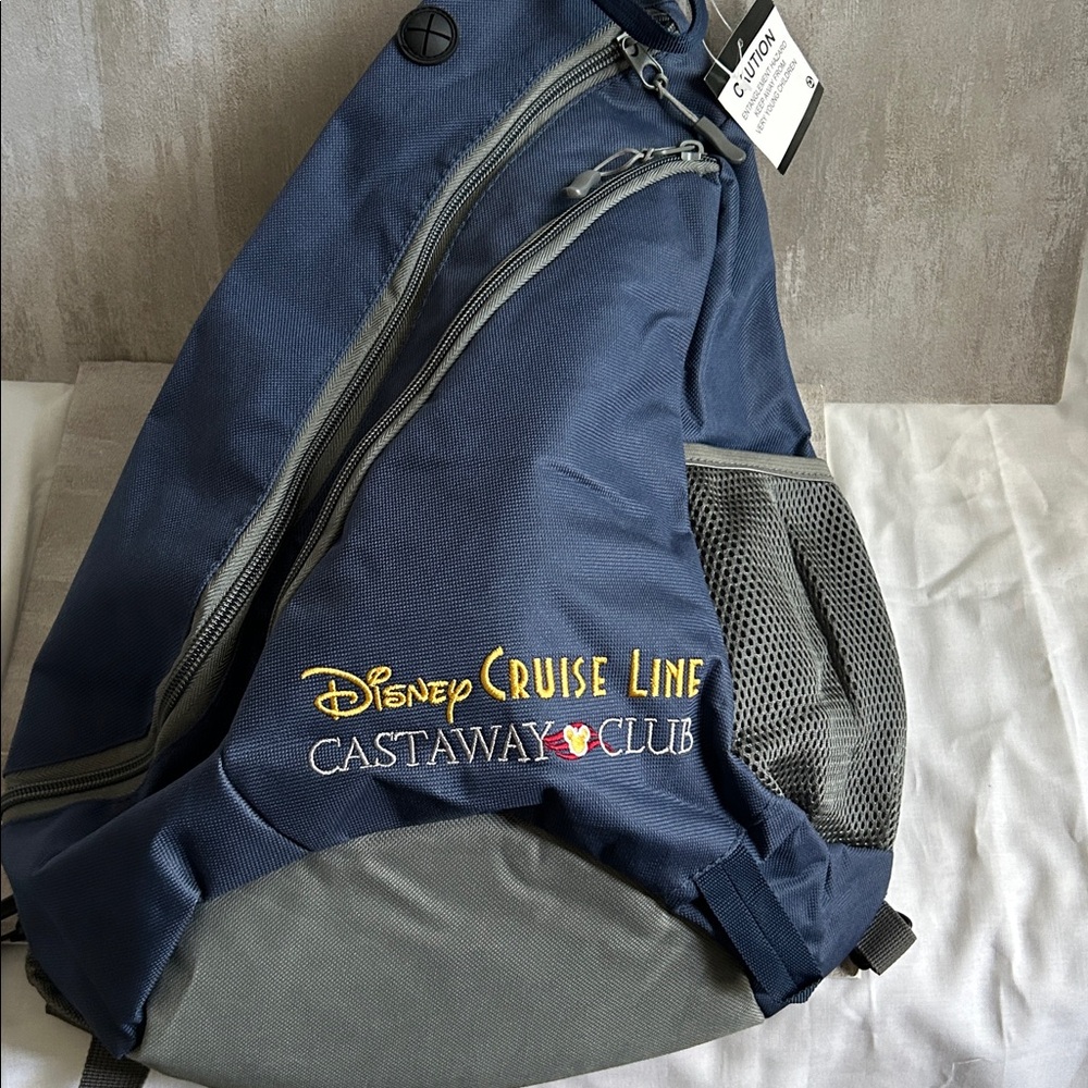 NWT. Disney Cruise Line Castaway Club 
Navy & Gray Blueish Sling Backpack